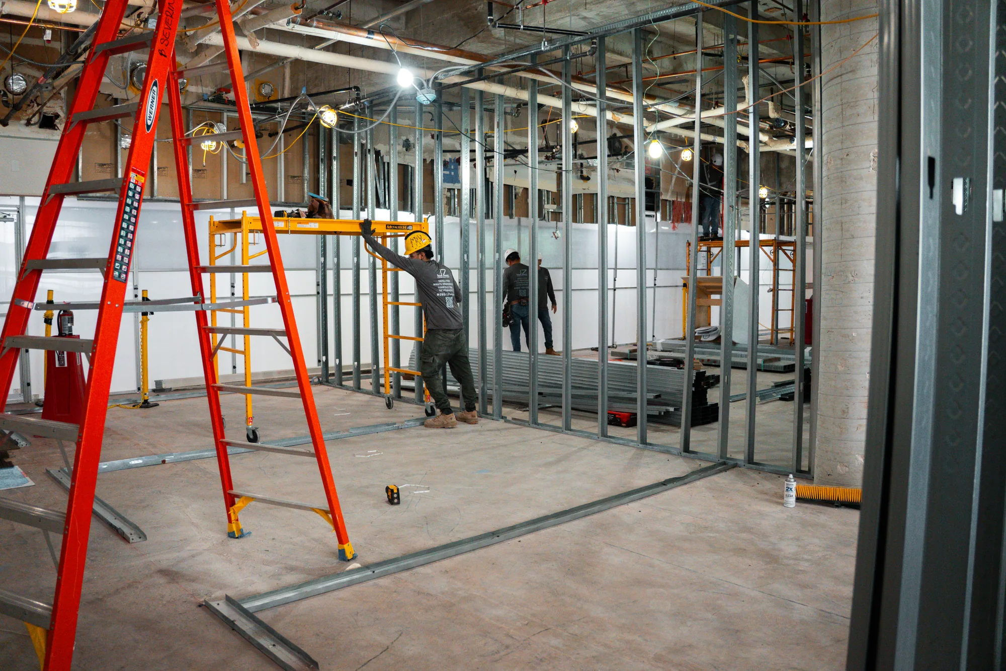 JZ crew coordinating interior framing and scaffolds at Bascom Palmer